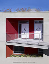 A detail view of the unit entries is depicted in this photo, which also shows green roofs above and below. Operable transom windows above the entry doors promote cross-ventilation. - Photo Credit: John Linden