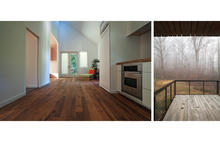 View of kitchen and living spaces towards rear of home. Back deck opens toward restored, native landscape. - Photo Credit: Ken McCown