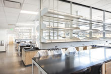 The research lab areas are laid out in open modules to allow for flexibility in usage by different researchers with differently scaled projects over time. The bench layout is perpendicular to the exterior windows to maximize daylighting penetration. - Photo Credit: Alene Davis Photography